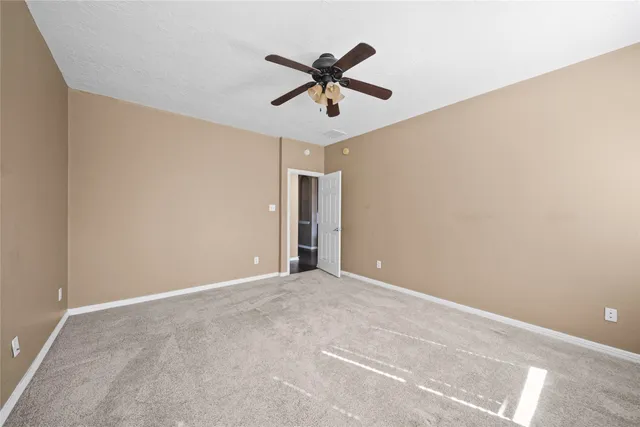 a view of a chandelier fan in a room