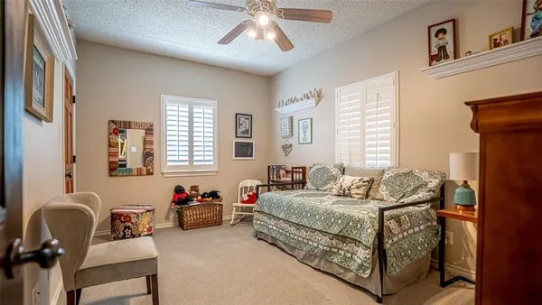 a bedroom with bed and window