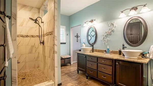 a bathroom with a mirror and a sink