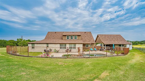 a view of a house with a big yard