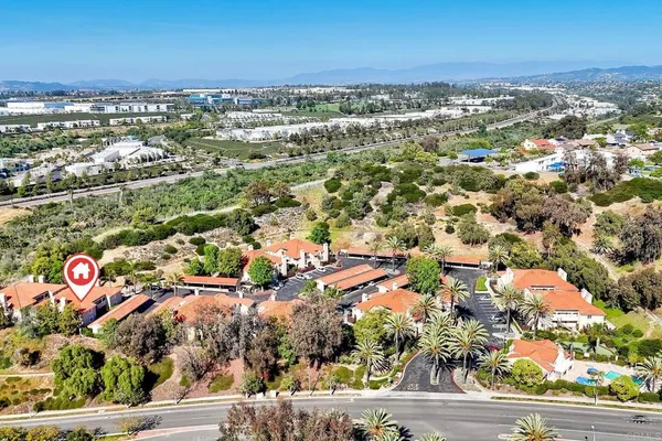 an aerial view of residential building and parking space
