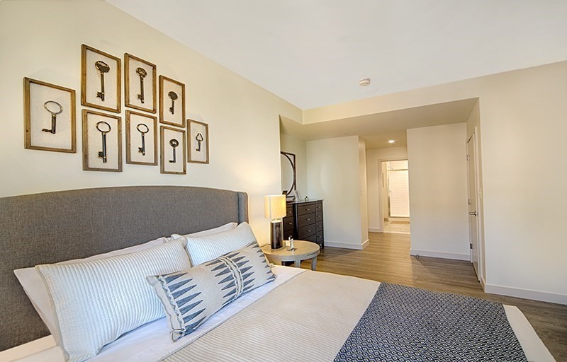 1 Canal Street, Unit 602 Boston, MA 02114 - Photo 6 of 12 a bedroom with furniture and a bed