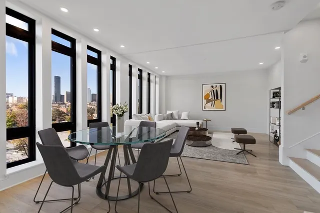 a view of a dining room with furniture window and outside view