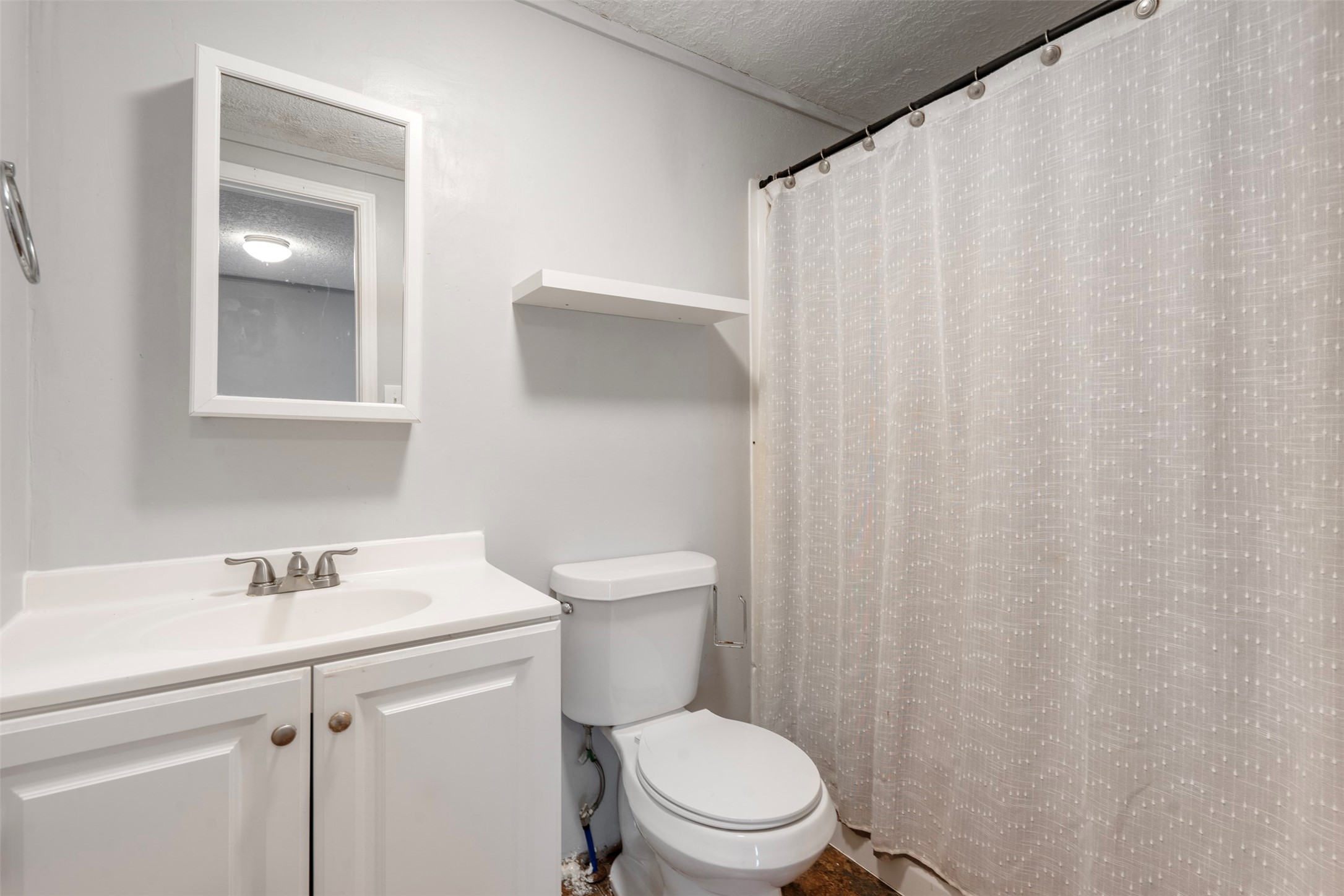 758 Blueberry Road Cove, TX 77523 - Photo 5 of 9 a bathroom with a sink a toilet and shower