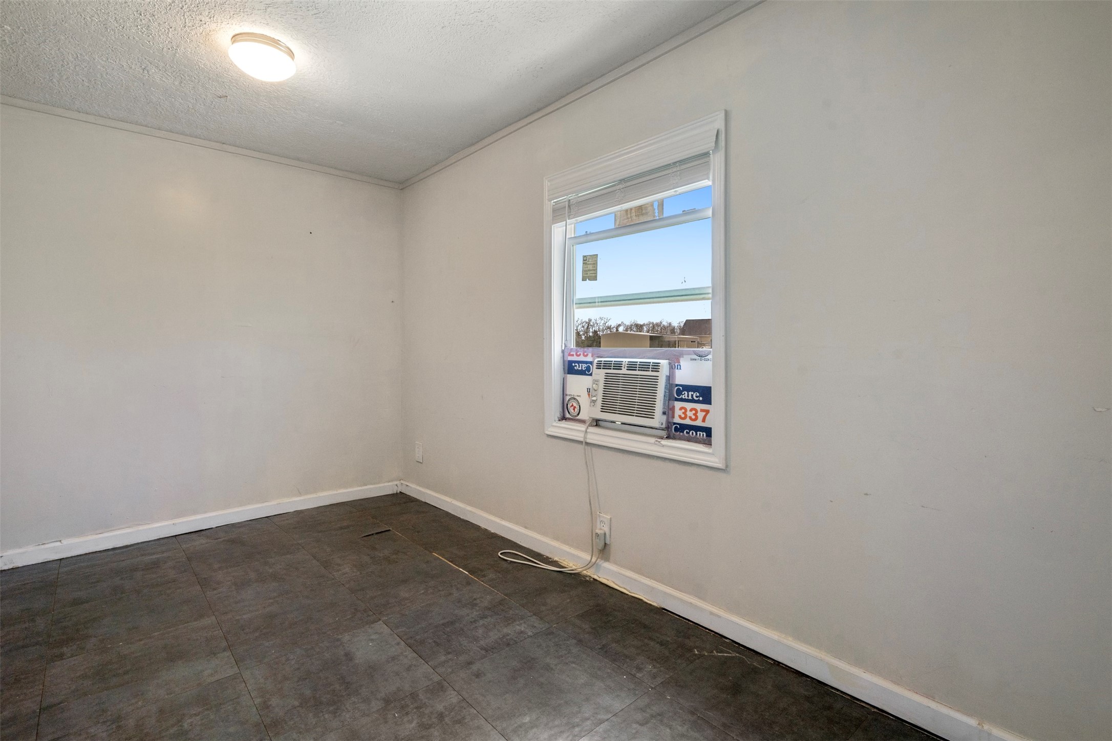 758 Blueberry Road Cove, TX 77523 - Photo 8 of 9 an empty room with windows