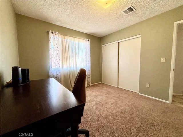 a view of a livingroom with furniture