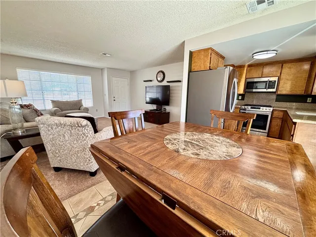a bedroom with furniture and a flat screen tv