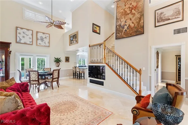 a spacious bedroom with a bed and a flat screen tv