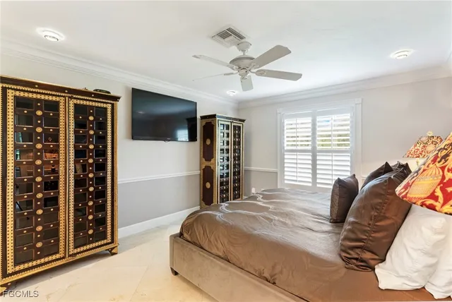 a bedroom with a bed and a lamp