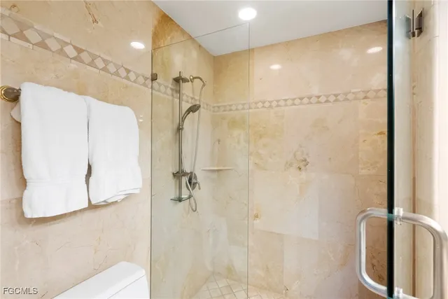 a view of a potted plant sitting in a bathroom next to a mirror