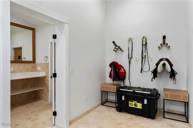 a view of kitchen with a refrigerator and cabinets