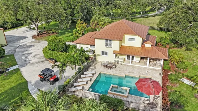 an aerial view of a house with an outdoor space