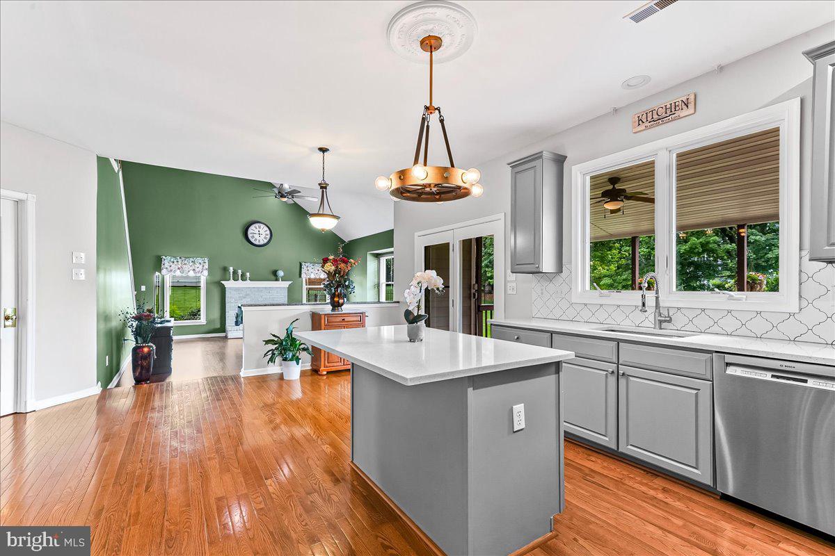 408 Brentford Road Kennett Square, PA 19348 - Photo 9 of 41 a view of living room with kitchen island furniture and a chandelier