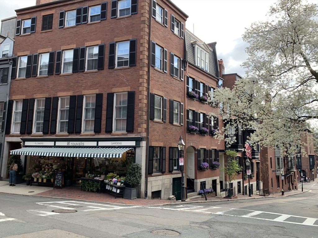 105 Pinckney Street, Unit 2 Boston, MA 02114 - Photo 12 of 13 a view of a building and a people