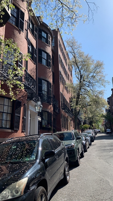 105 Pinckney Street, Unit 2 Boston, MA 02114 - Photo 13 of 13 a car parked in front of a building