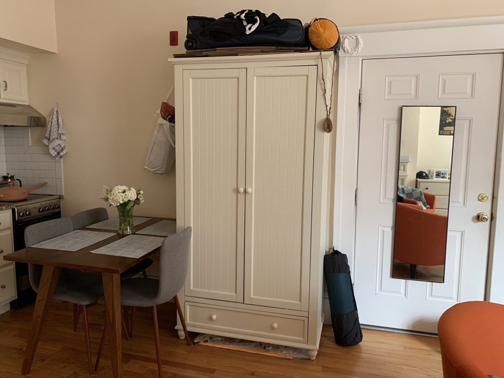 105 Pinckney Street, Unit 2 Boston, MA 02114 - Photo 3 of 13 a view of a livingroom with furniture and bathroom