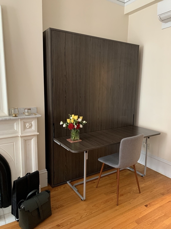 105 Pinckney Street, Unit 2 Boston, MA 02114 - Photo 7 of 13 a dining room with furniture and wooden floor
