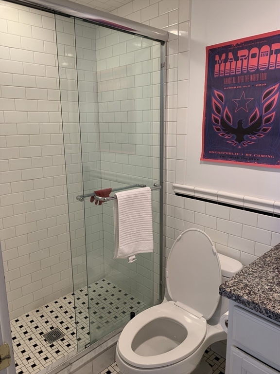 105 Pinckney Street, Unit 2 Boston, MA 02114 - Photo 9 of 13 a bathroom with a toilet and a shower