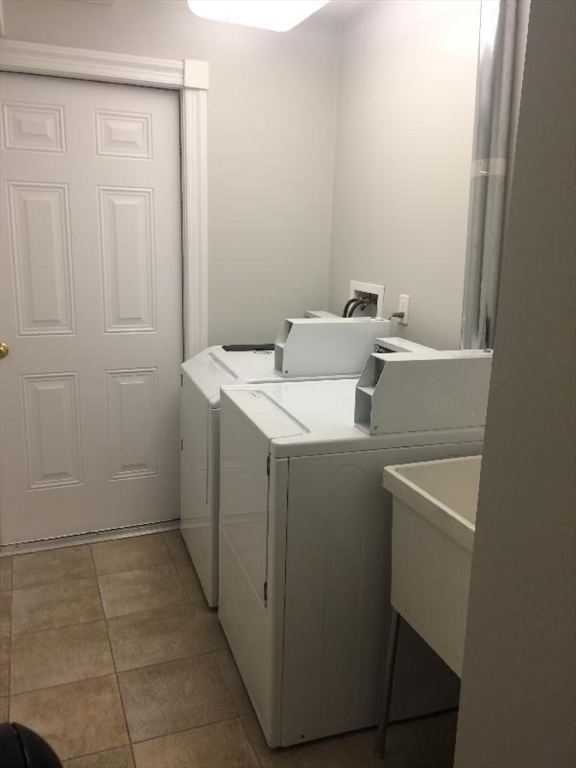 105 Pinckney Street, Unit 2 Boston, MA 02114 - Photo 10 of 13 a utility room with dryer and washer