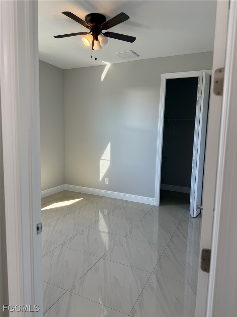 3013 4th Street West Lehigh Acres, FL 33971 - Photo 15 of 47 a view of an empty room with a window