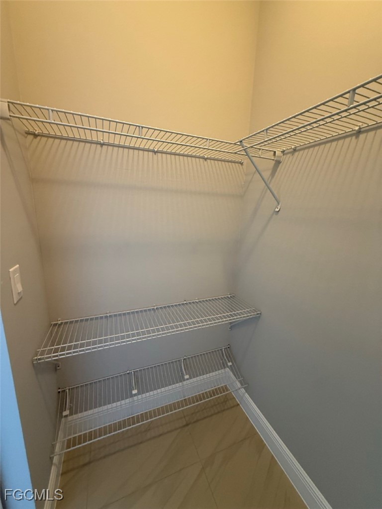 3013 4th Street West Lehigh Acres, FL 33971 - Photo 16 of 47 a view of a room with racks on the wall