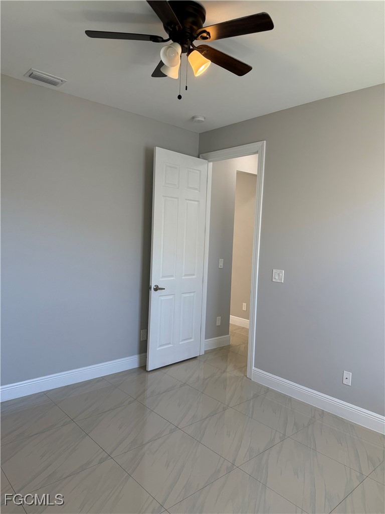 3013 4th Street West Lehigh Acres, FL 33971 - Photo 17 of 47 a view of an empty room