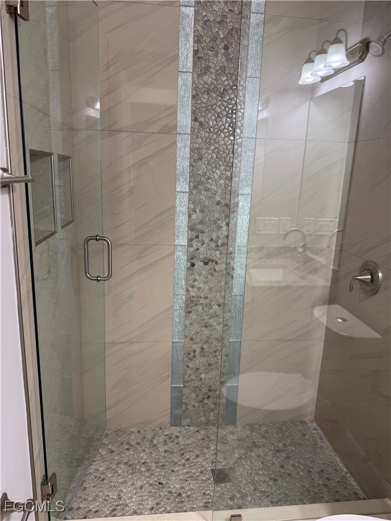 3013 4th Street West Lehigh Acres, FL 33971 - Photo 25 of 47 a bathroom with a shower