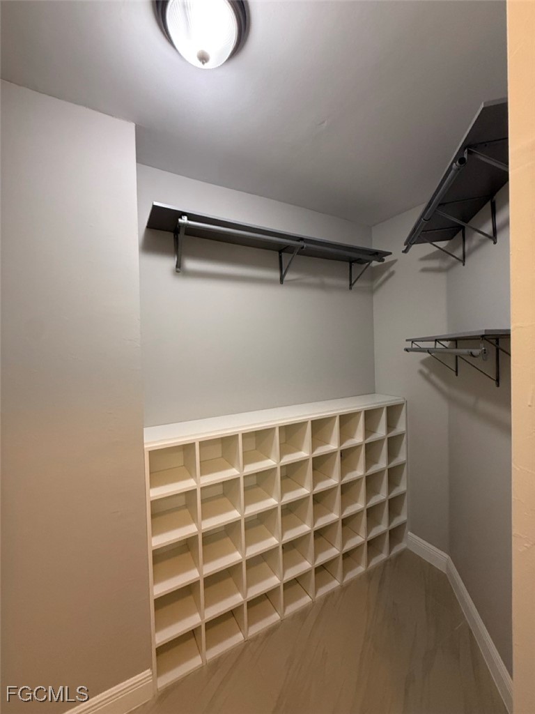 3013 4th Street West Lehigh Acres, FL 33971 - Photo 32 of 47 a view of an empty walk in closet