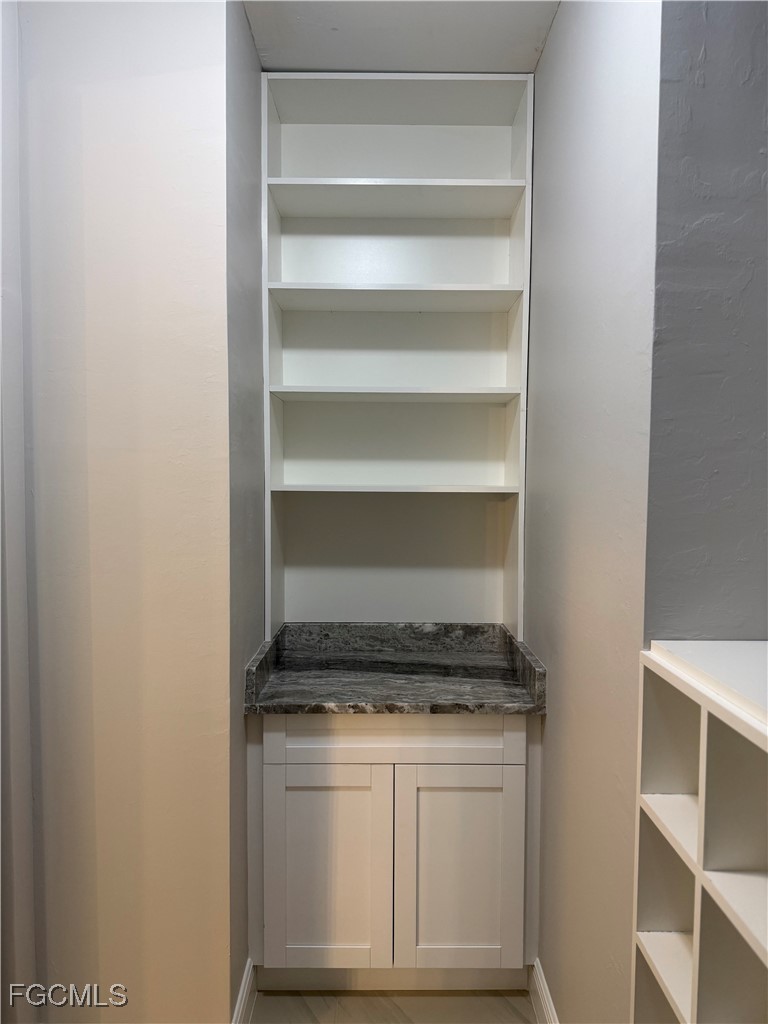 3013 4th Street West Lehigh Acres, FL 33971 - Photo 33 of 47 a stove top oven sitting inside of a kitchen