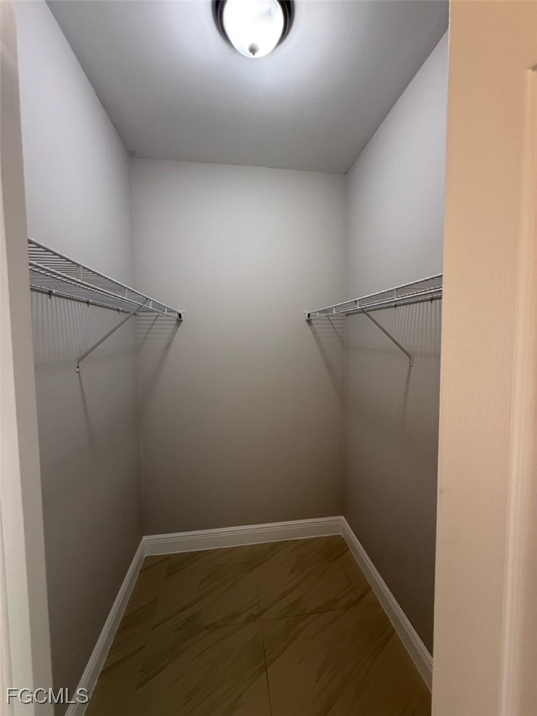 3013 4th Street West Lehigh Acres, FL 33971 - Photo 34 of 47 a view of a room with racks on the wall