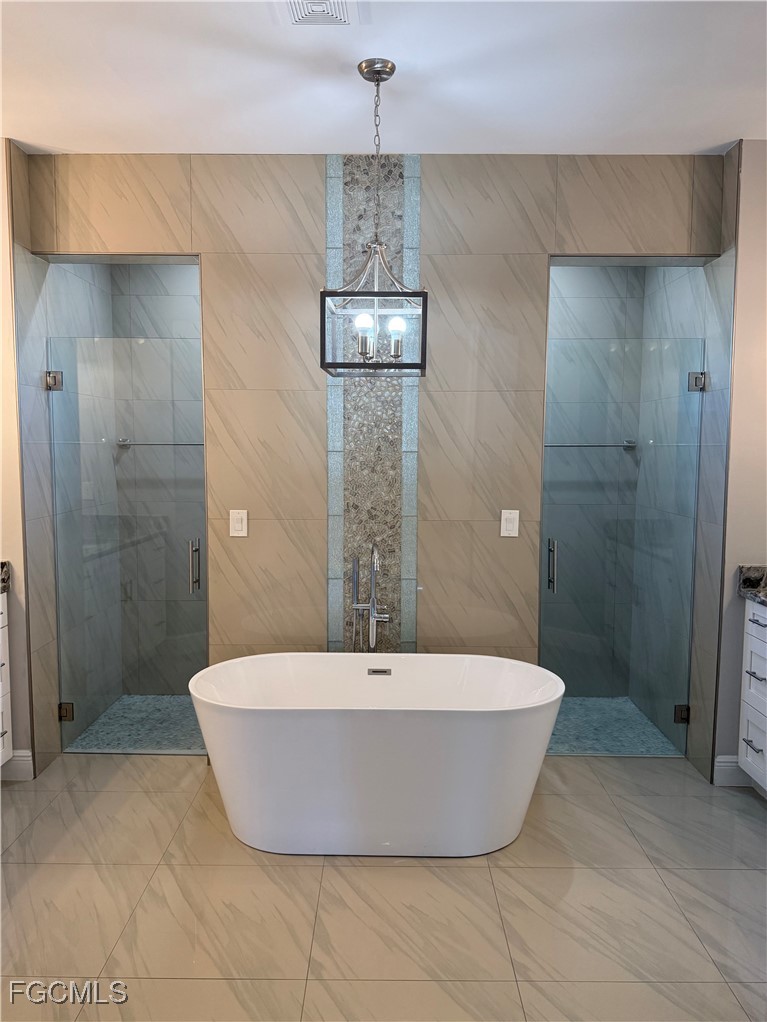 3013 4th Street West Lehigh Acres, FL 33971 - Photo 35 of 47 a view of a bathtub in bathroom and shower