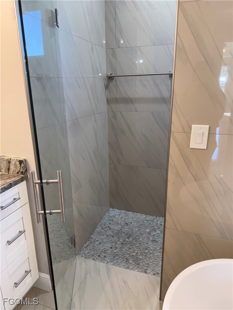 3013 4th Street West Lehigh Acres, FL 33971 - Photo 39 of 47 a bathroom with a sink and toilet