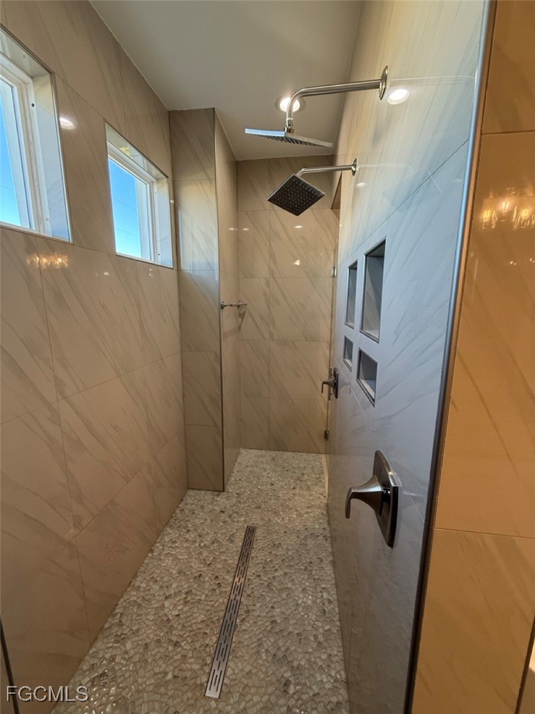 3013 4th Street West Lehigh Acres, FL 33971 - Photo 40 of 47 a bathroom with a shower