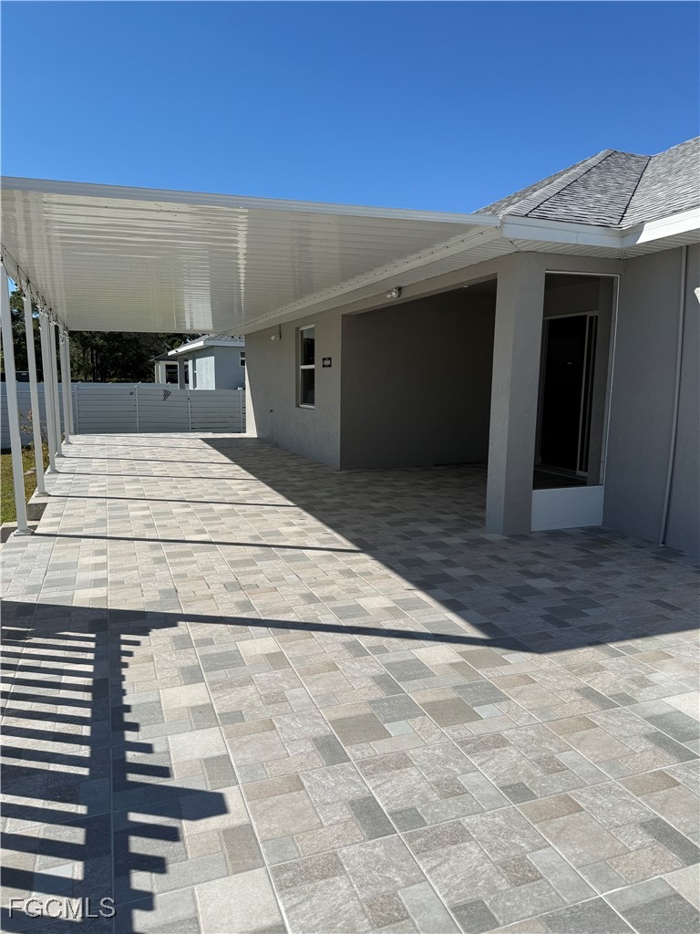 3013 4th Street West Lehigh Acres, FL 33971 - Photo 45 of 47 a view of entryway with a house