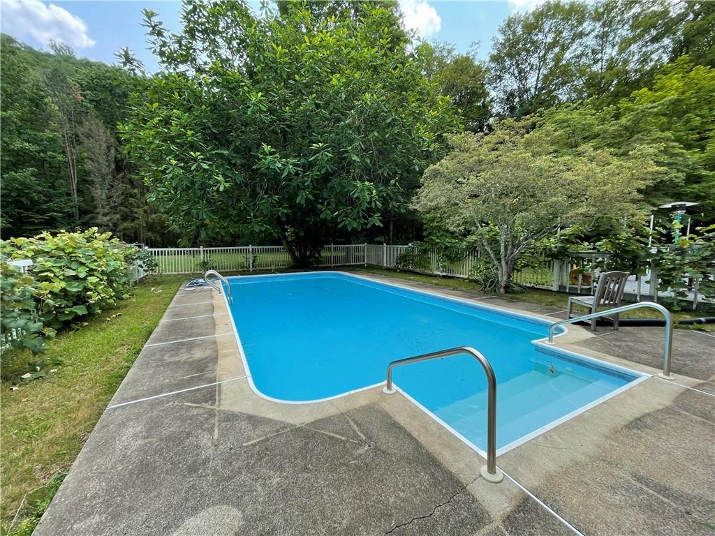 740 Four Mile Run Road Ligonier, PA 15658 - Photo 4 of 12 a view of a swimming pool with a patio