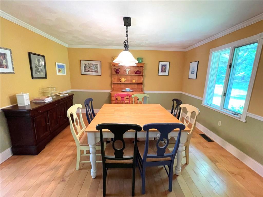 740 Four Mile Run Road Ligonier, PA 15658 - Photo 7 of 12 a dining room with furniture and window