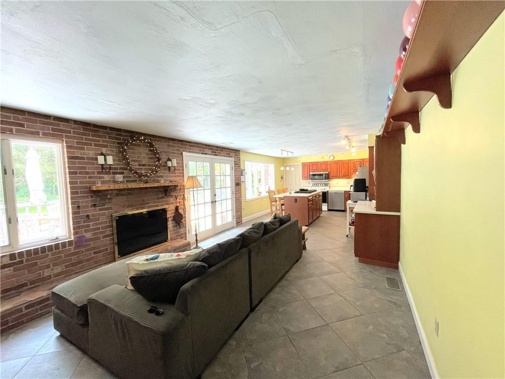 740 Four Mile Run Road Ligonier, PA 15658 - Photo 8 of 12 a living room with furniture and a fireplace