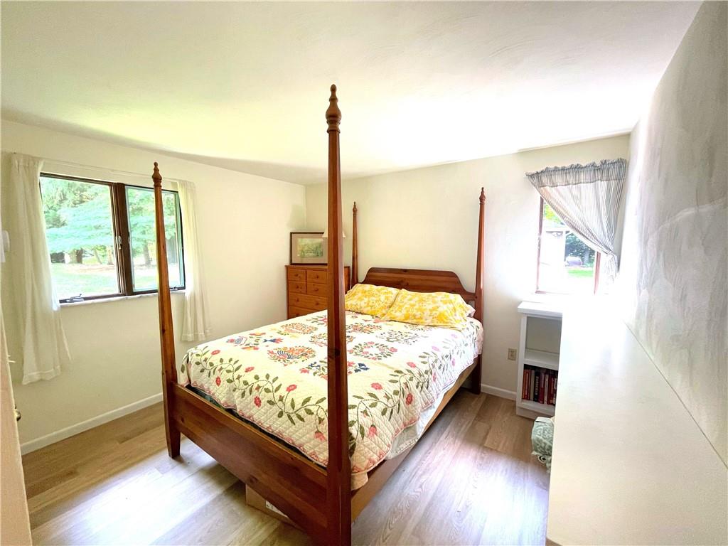 740 Four Mile Run Road Ligonier, PA 15658 - Photo 10 of 12 a bedroom with a bed and large window