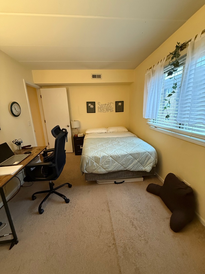 18135 Martin Avenue, Unit 2SW Homewood, IL 60430 - Photo 11 of 18 a bedroom with a bed and a desk