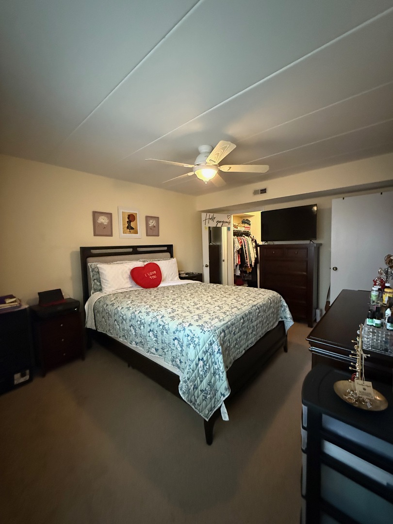 18135 Martin Avenue, Unit 2SW Homewood, IL 60430 - Photo 14 of 18 a bedroom with a bed and dresser