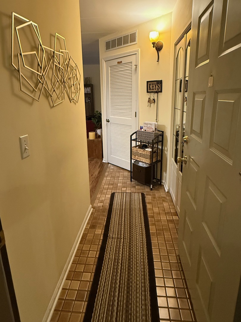 18135 Martin Avenue, Unit 2SW Homewood, IL 60430 - Photo 3 of 18 a bathroom with a sink and glass door