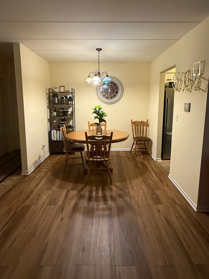 18135 Martin Avenue, Unit 2SW Homewood, IL 60430 - Photo 5 of 18 a view of a dining room with furniture window and wooden floor