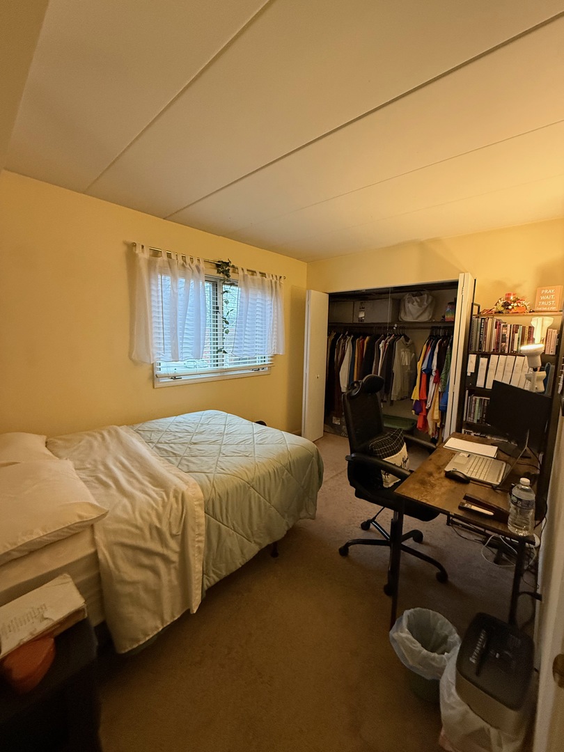 18135 Martin Avenue, Unit 2SW Homewood, IL 60430 - Photo 10 of 18 a bedroom with a bed and a desk