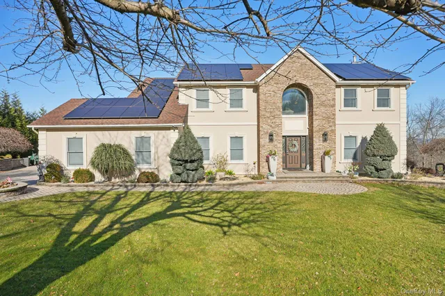 a front view of a house with swimming pool