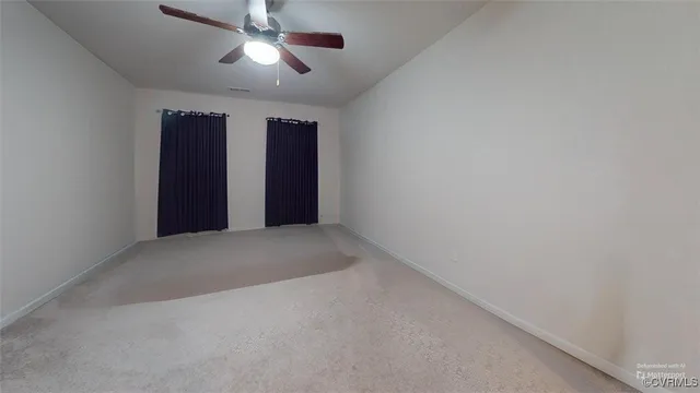 a bedroom with double bed and a chandelier