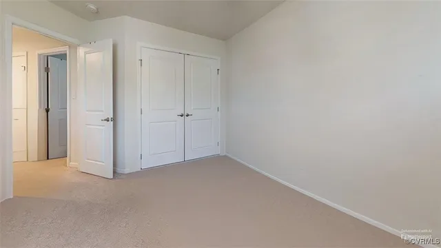 a bathroom with a sink vanity granite toilet and a mirror