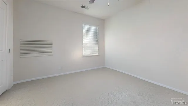 a view of a livingroom with furniture and a flat screen tv