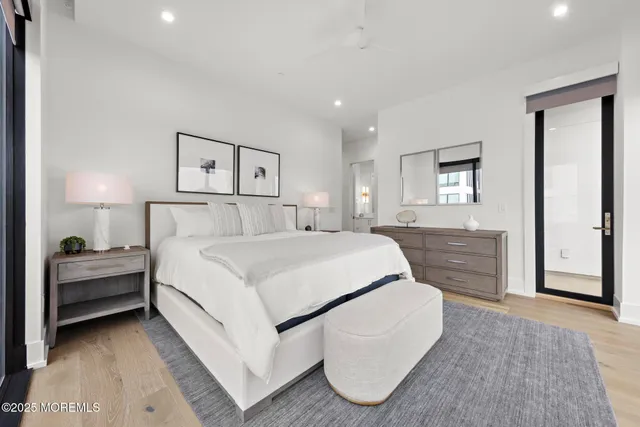 a bedroom with a bed and a couch