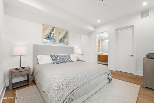 a bedroom with a bed and a lamp