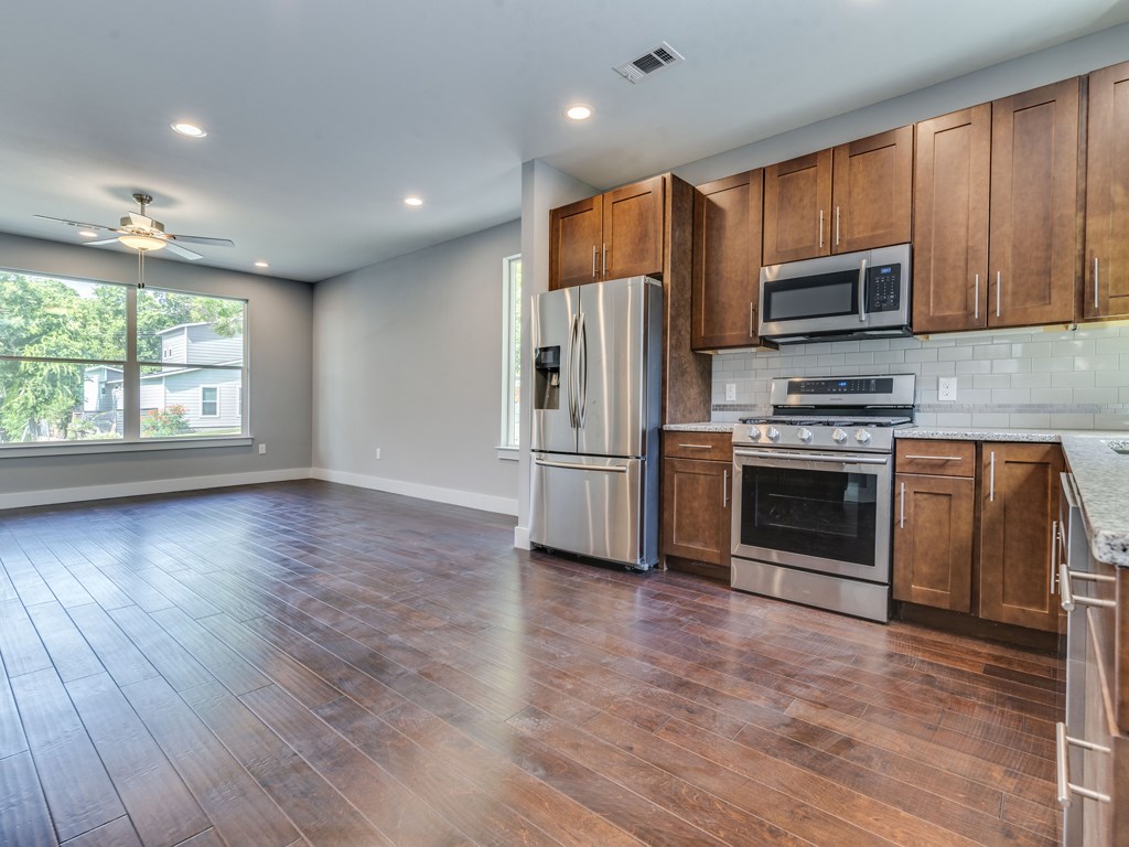 406 Post Rd Drive, Unit 1 Austin, TX 78704 - Photo 30 of 30 Kitchen and dining view overlooking the open floorplan into the bright living area